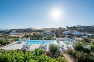 a view of a swimming pool in a resort at Kriolithos Houses in Parikia +22 photos