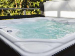 a white bath tub with water in it at Islay - Uk48416 in Dalry
