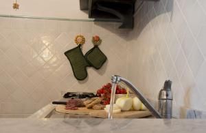a kitchen counter with a sink with a sink at Pescasseroli Appartamento Panoramico in Pescasseroli +58 photos