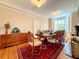 a dining room with a table and chairs at West View in Broughton