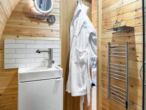 a small bathroom with a sink and a toilet at Arran - Uk48415 in Dalry