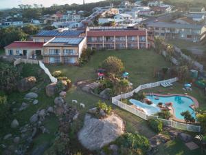 an aerial view of a house with a swimming pool at Secret Sands Glenmore Beach in Port Edward +22 photos