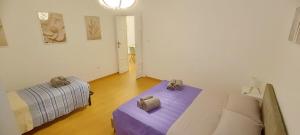 a living room with a bed and a couch at Civico 16 in Sulmona