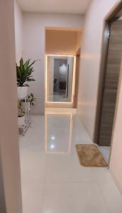a hallway with a mirror and a rug at Sorrento Homes in Pune +58 photos