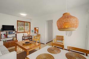 a living room with a couch and a table at A la Playa en San Agustín in Maspalomas
