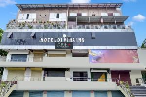 a building with a sign that reads hotel ubuntuulum inn at HOTEL O DIVIRA INN in Dhanbād +27 photos