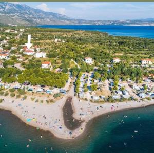 an aerial view of a beach with people in the water at Batea 2 in Seline +15 photos