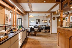 a kitchen and dining room with a dining table at Gasthof Wachter in Gaal