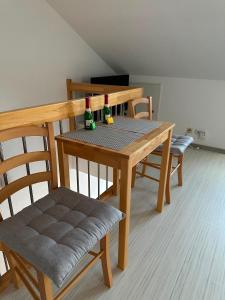a dining room table with two bottles on it at Ferienwohnung Litau in Sonthofen