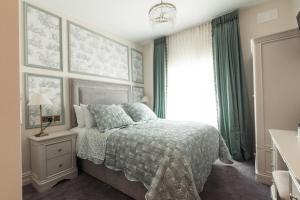 a bedroom with a bed and a window at Cloonacauneen Castle in Galway
