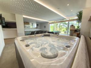 a large bath tub in a living room at Villa Petar Stone in Kamensko