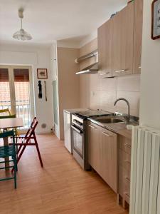 a kitchen with a sink and a stove top oven at I Due Timidi in Putignano