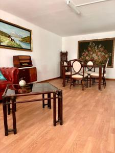 a living room with tables and chairs and a couch at I Due Timidi in Putignano +11 photos