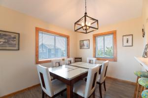 a dining room with a table and chairs at Knottaway - Duck, Sound Sea Village, Ocean View, 125 Yds to Beach, Pets OK, Flex Stays in Duck +28 photos