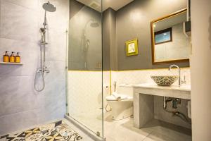 a bathroom with a shower and a toilet and a sink at Na Vayla PaPlern in Bangkok +53 photos