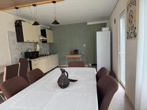 a kitchen with a table with a vase on it at Chalet Gveleti in Barisakho