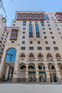 a large building with windows on the side of it at Maysan Rotana El Mysk Fully Renovated in Medina