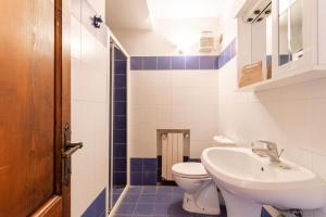 a bathroom with a toilet and a sink at Casale Bianca Luce in Santa Luce +34 photos