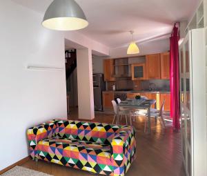 a living room with a couch and a table at Viale Monza Chic Stay - Affitti Brevi Italia in Milan +13 photos