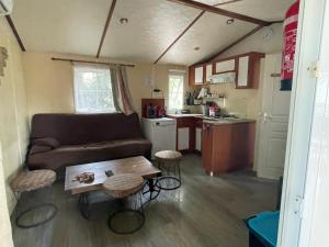 a living room and kitchen in a tiny house at Mobile Home Agde Les Sables D'or in Le Grau-dʼAgde