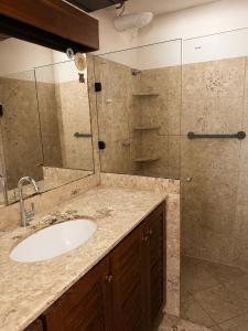 a bathroom with a sink and a shower at Casaboa Casarão Boutique Orla in Itacaré +43 photos