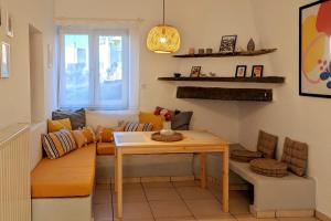 a living room with a couch and a table at Theros House in Ioulis