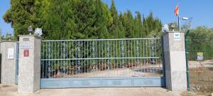 a gate with a fence with flowers on it at Villa Pardalot Boutique Stays in Benicarló
