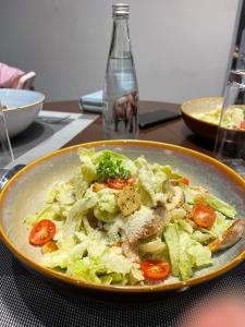 a plate of food on a table with a salad at The palace lanka in Yakwala