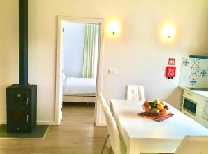 a room with a table with a bowl of fruit on it at AAA plus in Nordeste