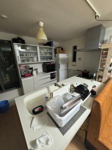 a kitchen with a counter with a sink on it at Tokyo Shinichi House A in Tokyo