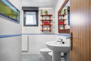 a bathroom with a sink and a toilet at Chalet Picu Fontanielles en Colunga in Colunga +15 photos