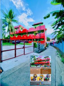 a sign in front of a building with a fence at Polangui Transient Room A Simple Transient House in Polangui +11 photos