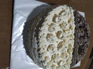 a cake sitting on top of a table at Debi in Lentekhi