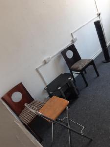 two chairs and a table in a room at VOB Enterprises in Chatham