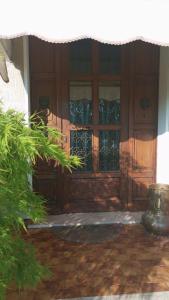 a wooden door with a window in a house at Casa Rosmarina in Pieve di Soligo