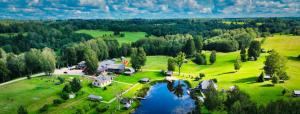 an aerial view of a house and a lake at Nõiariik Holiday Village in Antsla