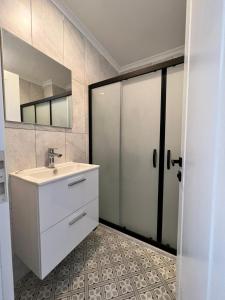 a bathroom with a sink and a mirror at Dada Otel in Ezine +21 photos