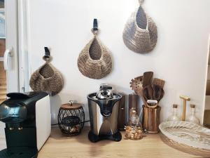 a counter with a blender and other kitchen utensils at Cottage spirit in Normandy - typical studio in Évreux