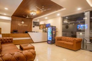 a lobby with couches and a bar in a store at Hotel Saesha International in Rāmeswaram