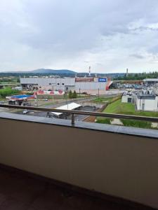 a view of a parking lot from a balcony at Zmaj LUX 2 in Mladenovac