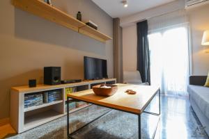 A television and/or entertainment centre at Phaedra Apartment