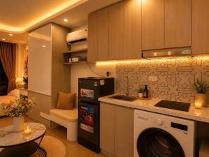 a kitchen with a washing machine in a room at My House in Hanoi