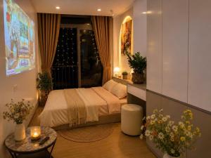 a small bedroom with a bed and a window at My House in Hanoi