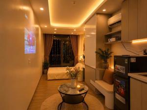 a small living room with a bed and a table at My House in Hanoi