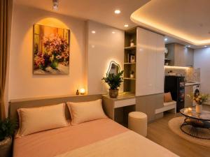 a bedroom with a bed and a living room at My House in Hanoi