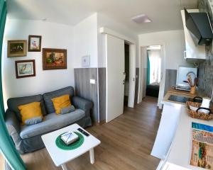 a living room with a couch and a table at Paisaje Lunar in Tinajo