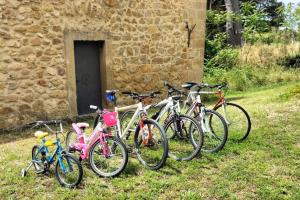 a group of bikes parked in front of a stone building at Feudo Rosso di Cerami in Enna +13 photos