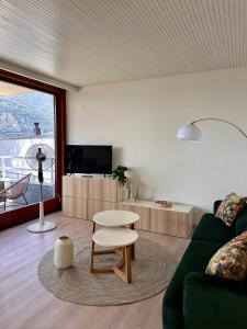 a living room with a couch and a table at Riflesso Apartment in Blevio