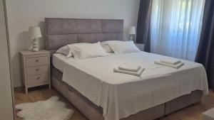 Voodi või voodid majutusasutuse Leona apartment-perfect for four toas