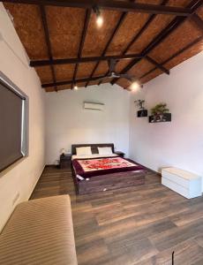 a bedroom with a bed and a flat screen tv at Rathi property in Gurgaon